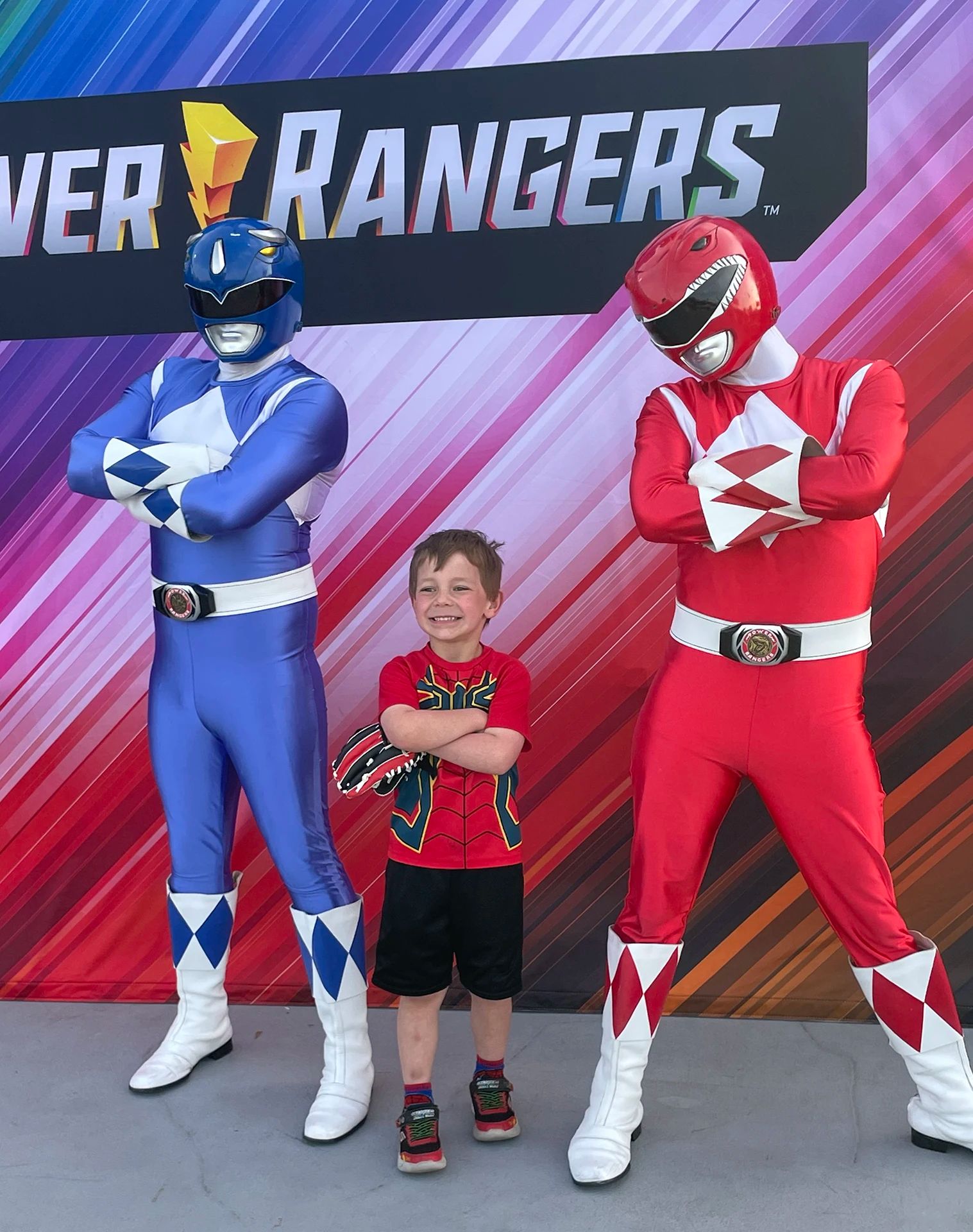 Blue Ranger and Red Ranger standing with a fan